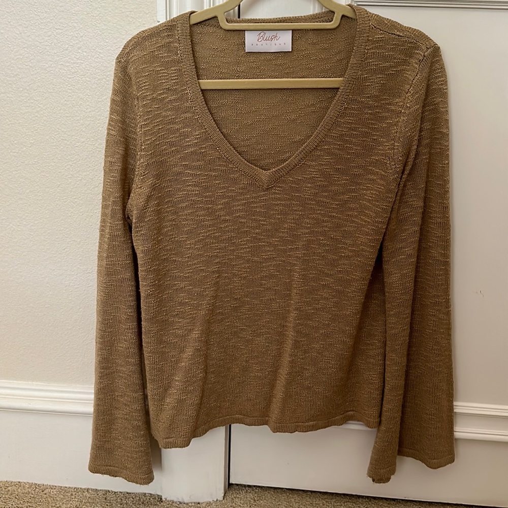 Women’s light weight gold sweater.